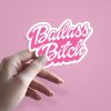 Woman holding Badass Bitch bold statement sticker