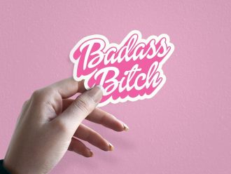 Woman holding Badass Bitch bold statement sticker