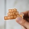 Man holding Big Dick Energy funny statement sticker