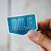Man holding DILF Father's Day sticker
