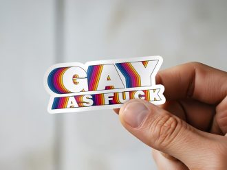 Man holding Gay As Fuck fabulous pride sticker