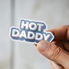 Man holding Hot Daddy masculine humor sticker