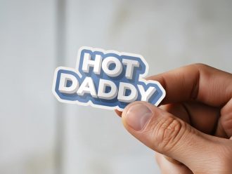 Man holding Hot Daddy masculine humor sticker