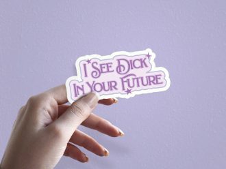 Woman holding I See Dick In Your Future prediction sticker