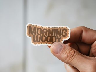 Man holding Morning Woody bachelor party sticker