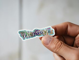 Man holding The Gayz gay celebration sticker