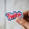 Man holding Twink LGBTQ pride sticker