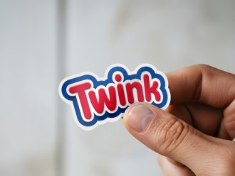 Man holding Twink LGBTQ pride sticker