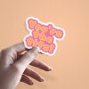 Woman holding You're The Tits thank you sticker