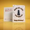 Rock Out With Your Cock Out funny birthday card with removable crystal penis and gold foil guitars shown front and back on colorful background