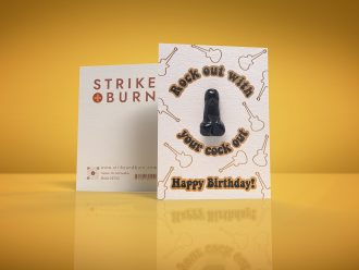 Rock Out With Your Cock Out funny birthday card with removable crystal penis and gold foil guitars shown front and back on colorful background