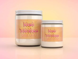 Hot Titties tropical hibiscus coconut bachelorette party candle  with pink label and poolside Spring Break vibes